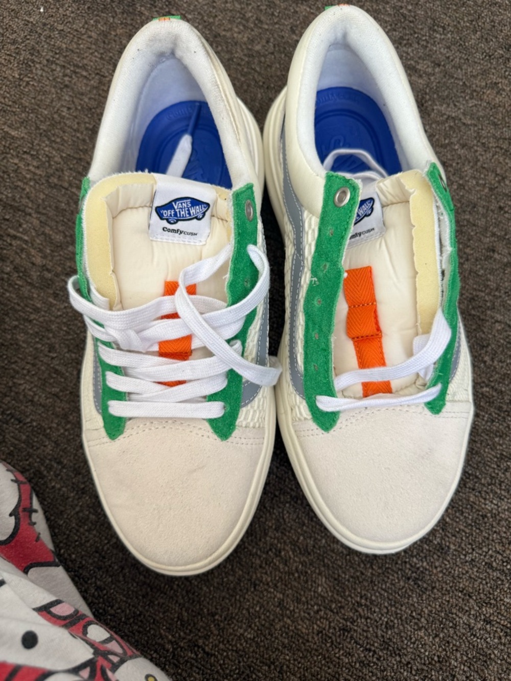 Vans Kids White Sneakers with Green Trim and Orange Accent